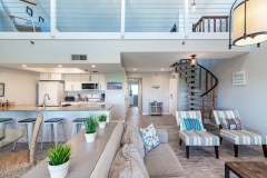 View of living room, dining room, kitchen